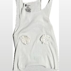 Handmade white tank with conveniently-placed florets